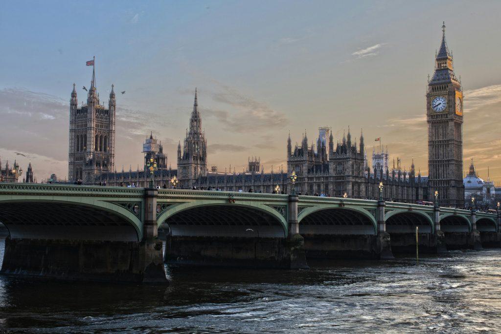 Stunning view of Big Ben and Westminster Bridge at sunset. Iconic London landmark.
